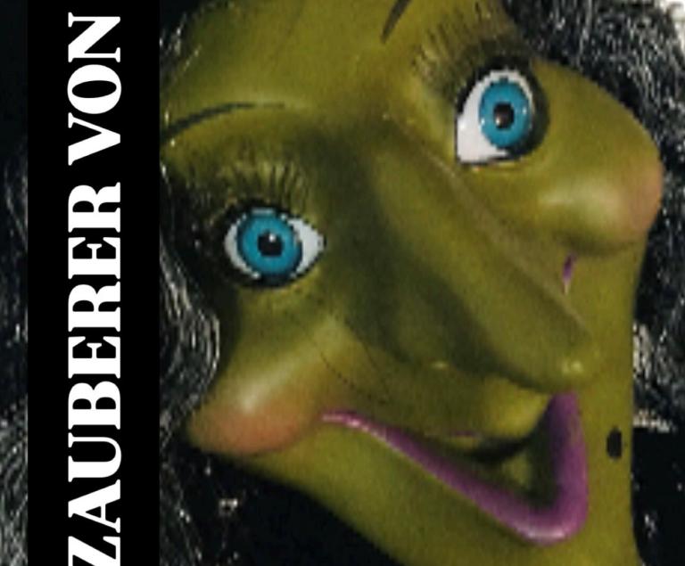 Das Bild zeigt die gelbe Maske einer Hexe.